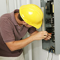 Copy-of-bigstockphoto_Electrician__Breaker_Panel_2009684