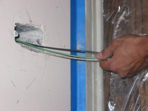 electrician pulling wires in beverly hills home