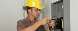 electrician working on electrical panel