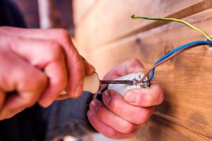 electrician installing new device