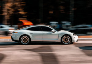 porsche taycan driving down road