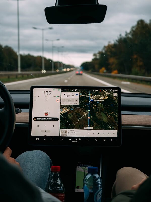 inside of tesla vehicle displaying dashboard