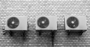 ac units outside a building on a wall