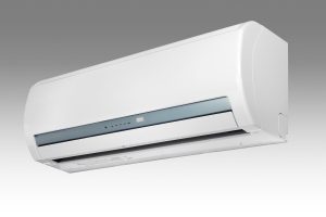 A sleek, modern white wall-mounted indoor mini-split air conditioner unit against a grey gradient background.